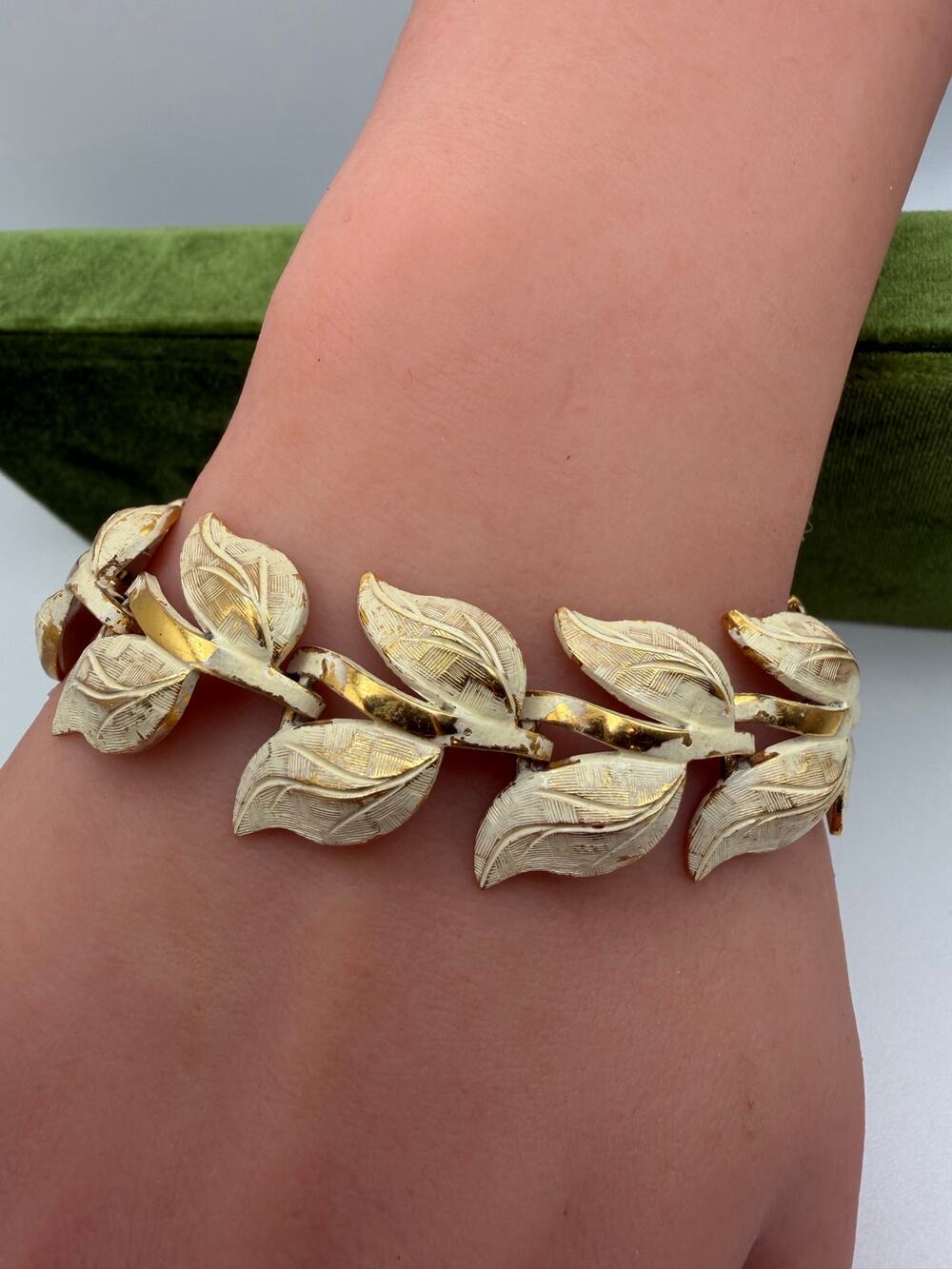 white enameled and gold-tone leaf link costume bracelet Monet